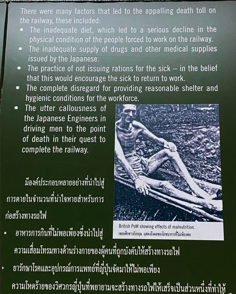 Image of an exhibit showing a black and white photo of a man with malnutrition on a stretcher.