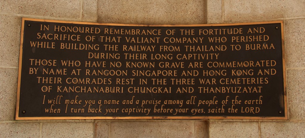 Image of a sign inside the cemetery honouring the fortitude and sacrifice of those that perished while building the railway from Thailand to Burma.